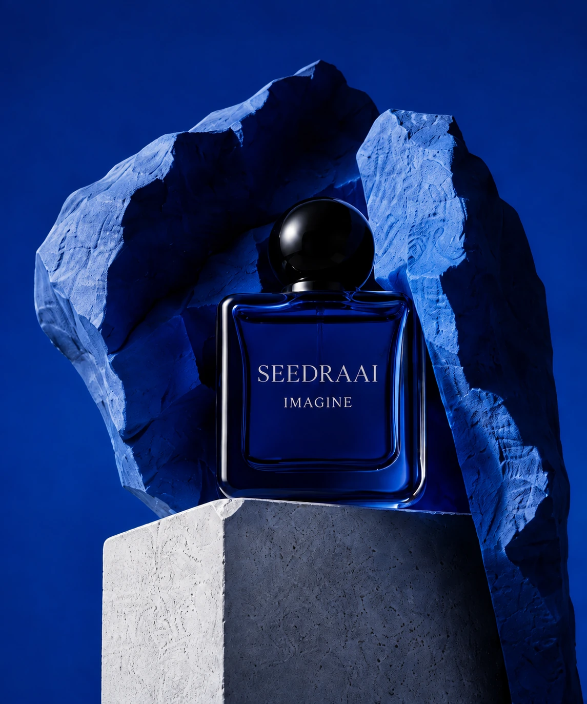 Cobalt perfume bottle in a sculptural product composition